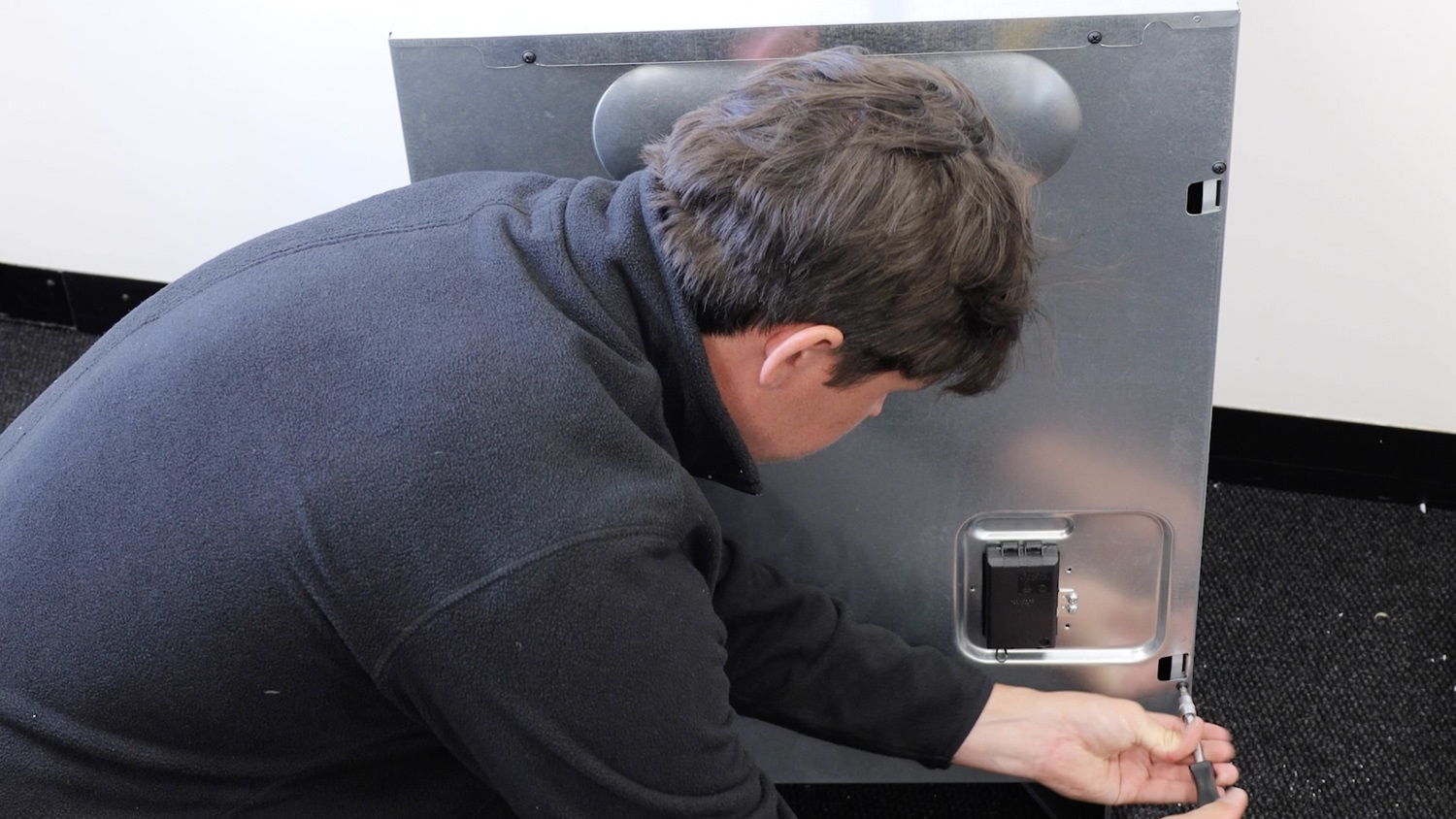 Re-screw screws on rear panel